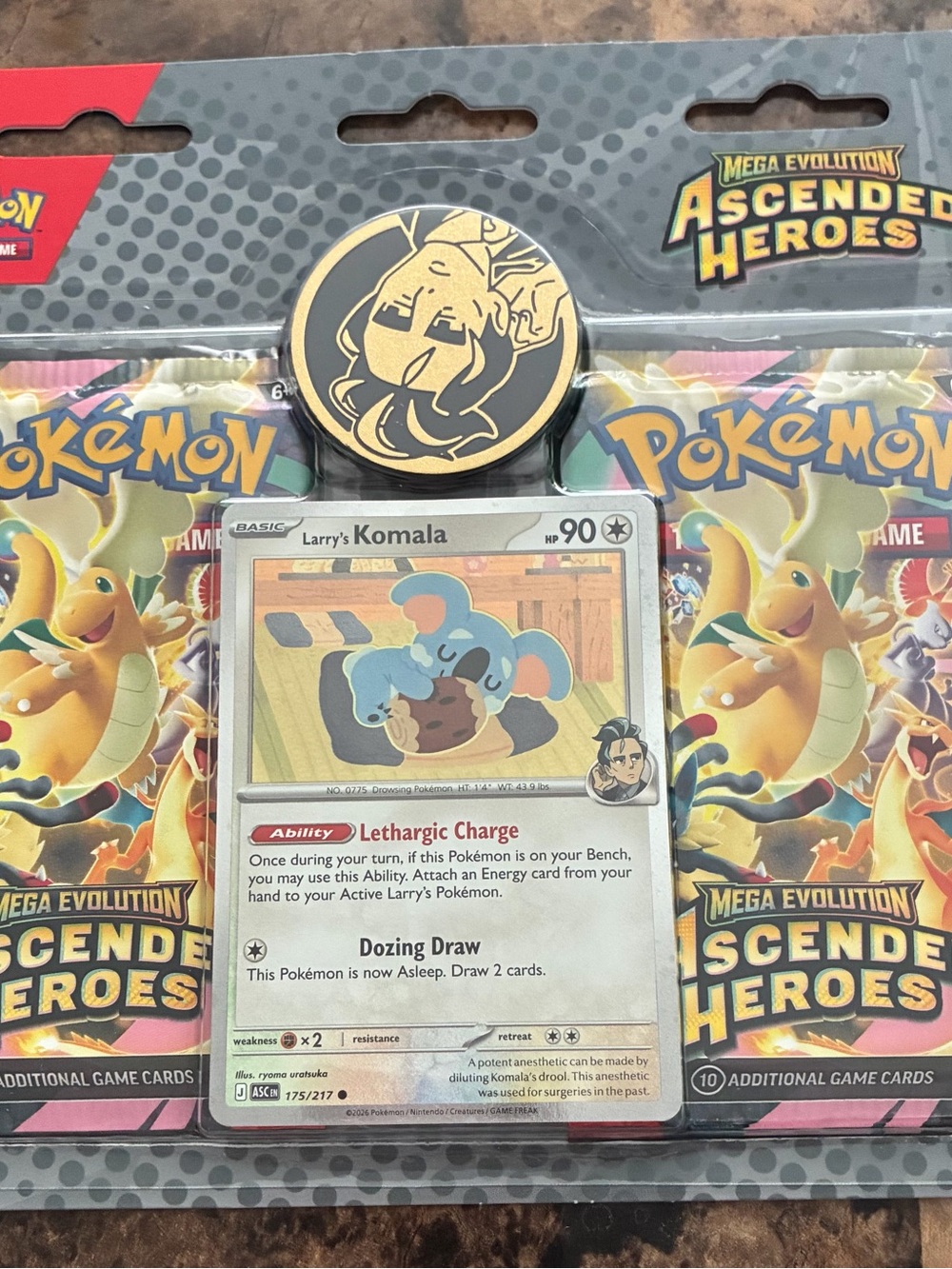 Pokémon Larry's Komala Promo Pin & Card Pack - Blue, Tan